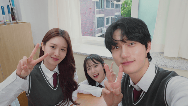 Students posing for a selfie in the classroom