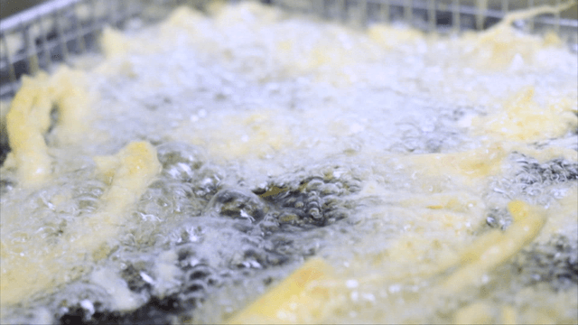 Ginseng fritters frying in hot oil