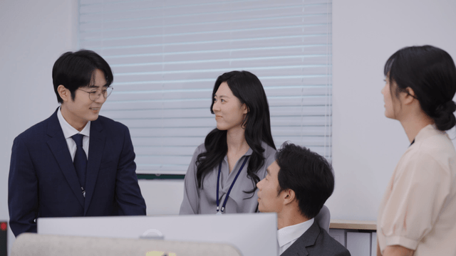 Office meeting with colleagues discussing