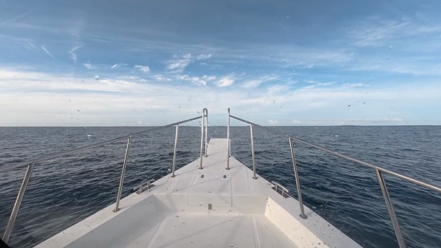 A yacht sailing on a calm sea