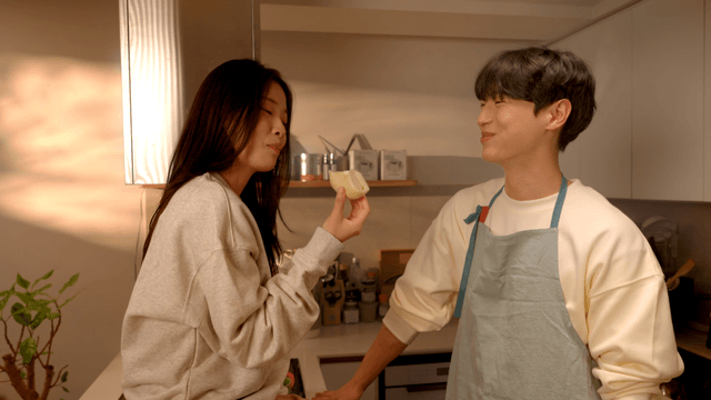 Couple enjoying simple bread together in kitchen