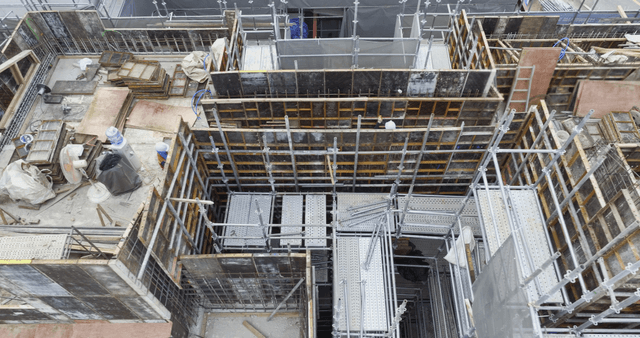 Construction site with workers and scaffolding