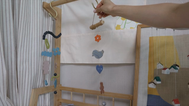 A mobile hanging in a cozy room