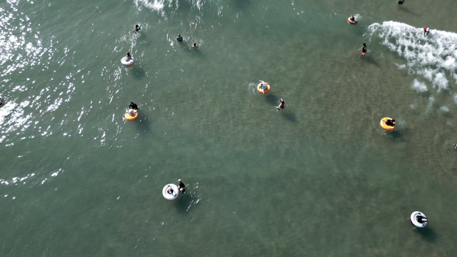 People enjoying a sunny day at the beach