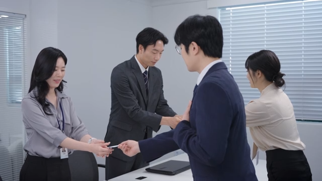 Business meeting with card exchange