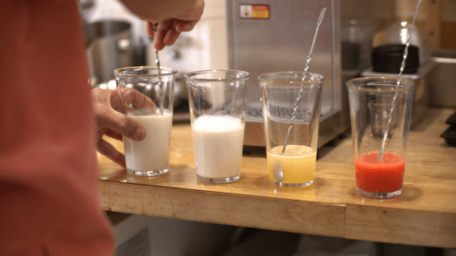 Preparing various drinks on a counter