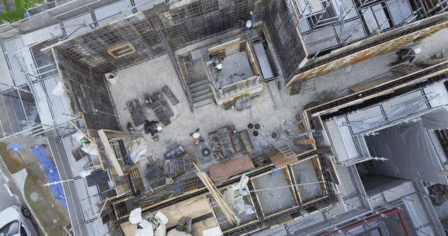 Construction site with workers in helmets