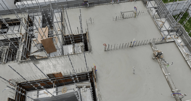 Building under construction near a golf course