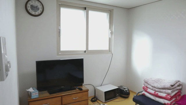 Simple room with a window and clock