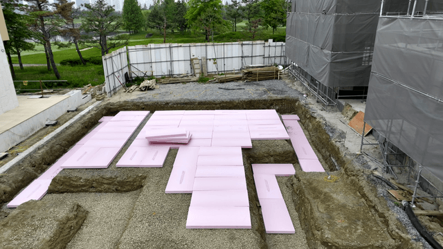 Construction site with pink insulation boards