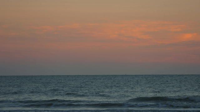 Waves under the serene evening sky