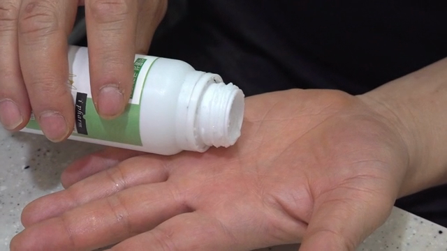 Pouring liquid onto a hand