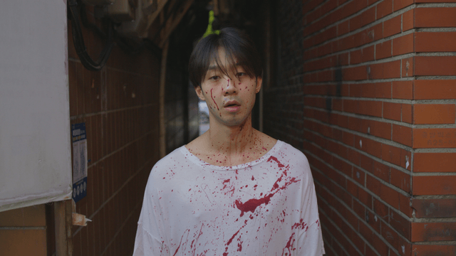Man in blood-stained clothes