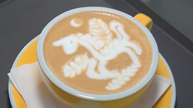 Latte art with a unicorn design in a cup