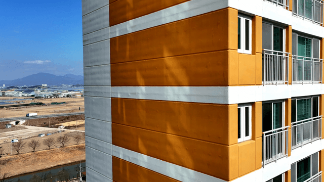 Apartment building with a field view