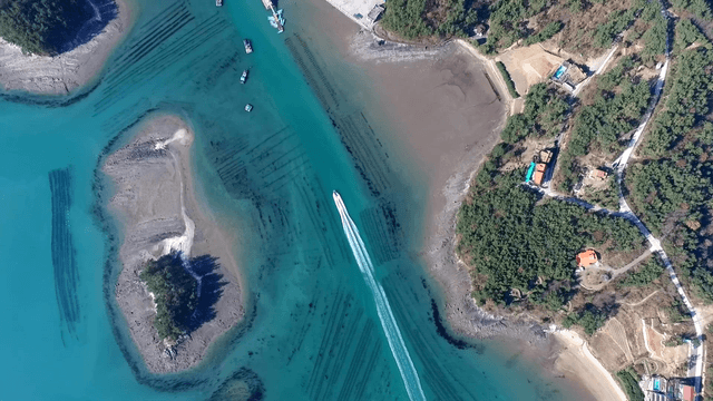 Boat cruising through clear blue waters