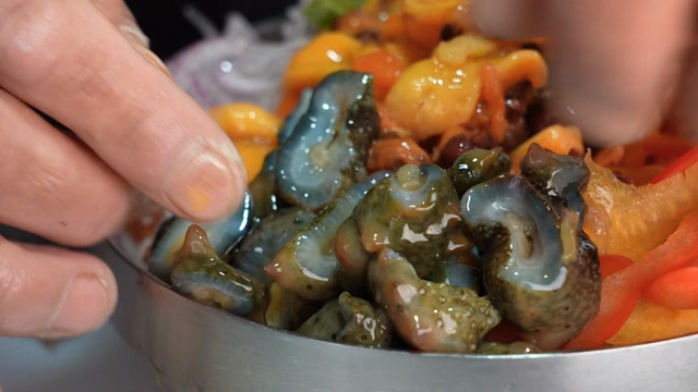 Preparing fresh seafood bibimbap