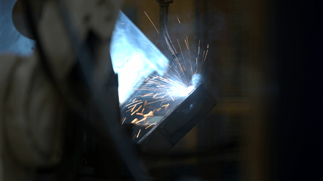 Robotic arm welding metal parts