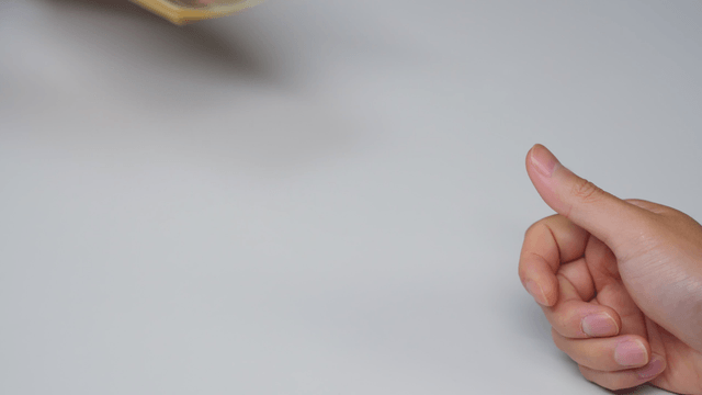Hands exchanging currency notes