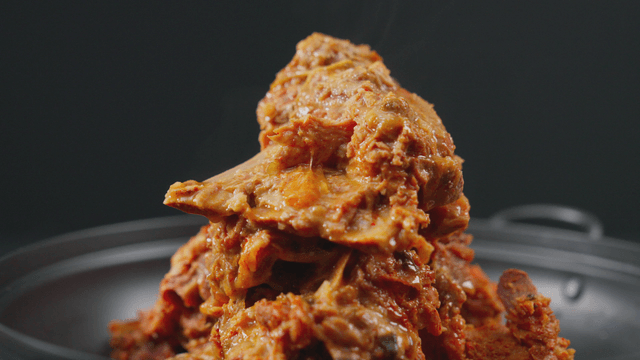 Pork backbone stew in steaming pot