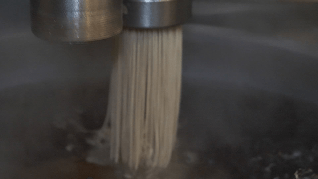 Buckwheat noodles extruded into boiling water