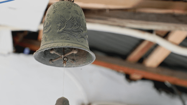 A decorative wind-bell hanging indoors