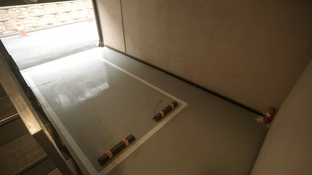 Empty parking space with fire extinguisher