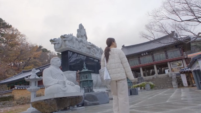 Woman exploring a traditional temple