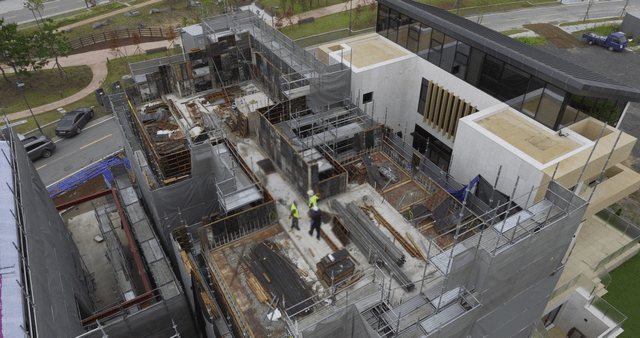 Construction site with workers and scaffolding