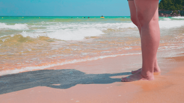 People enjoying clear beach