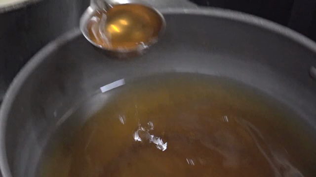 A ladle for scooping broth from a pot