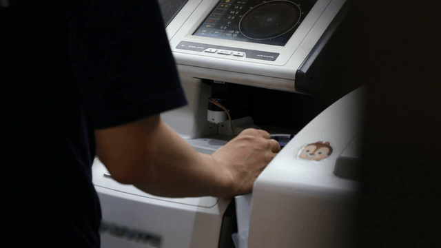 Person operating a machine indoors
