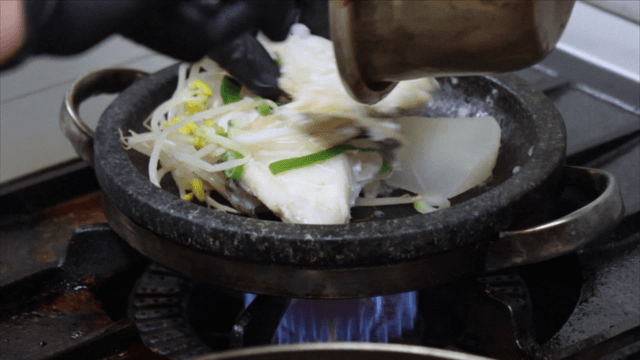 Braised cod grilled on stone plate