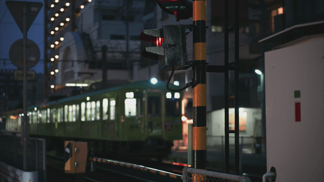 Nighttime city scene with a passing train