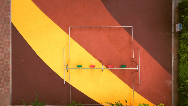 Colorful playground with swings and trees