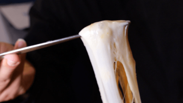 Braised chicken covered with stretching cheese