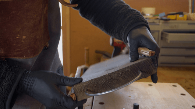 Craftsman working with wood and metal