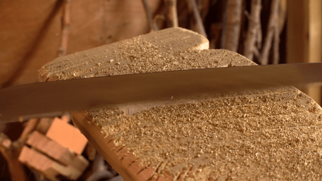 Wood being cut with a saw in a workshop