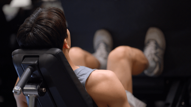 Man exercising on a leg press machine