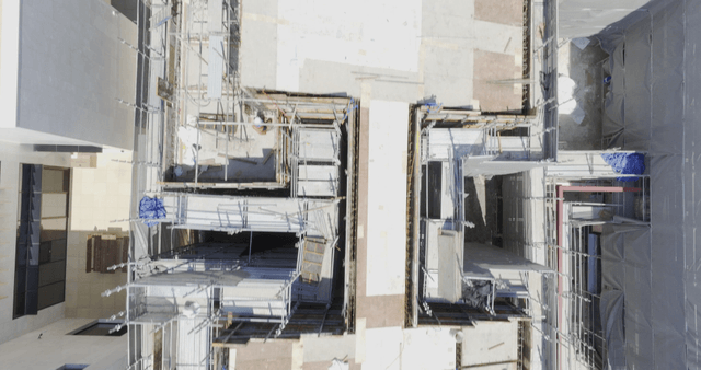 Construction site with scaffolding and materials