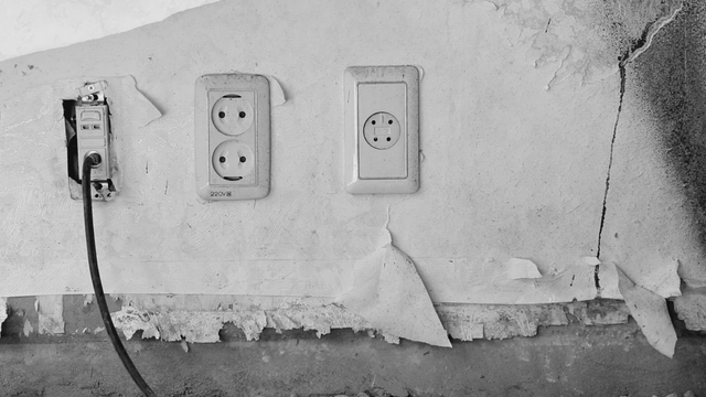 Old wall with electrical outlets