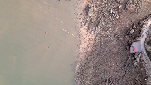 Rocky shoreline with a small dock