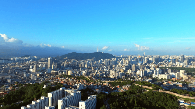 Sprawling cityscape with distant mountains