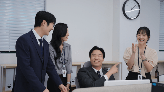 Office workers discussing a project