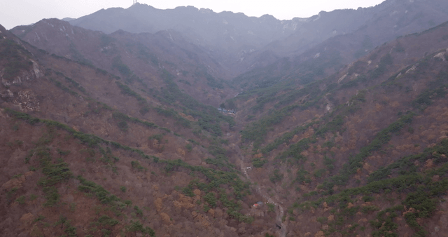A vast mountain range with valleys