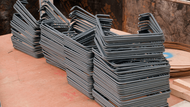 Steel rods stacked at a construction site