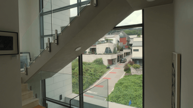 House staircase overlooking a residential view