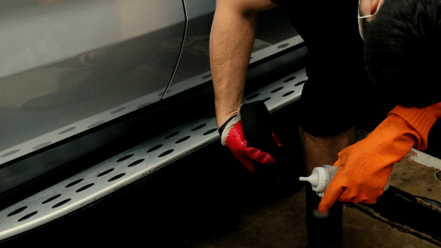 Person  cleaning a car with care