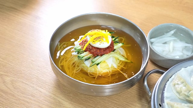 Korean Cold Buckwheat Noodles and dumplings on a table