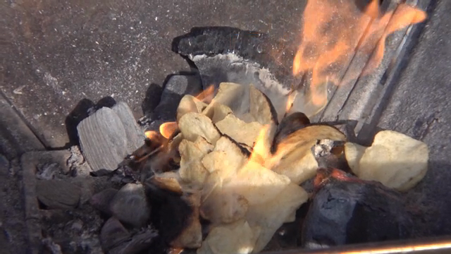 Potato chips burning with charcoal